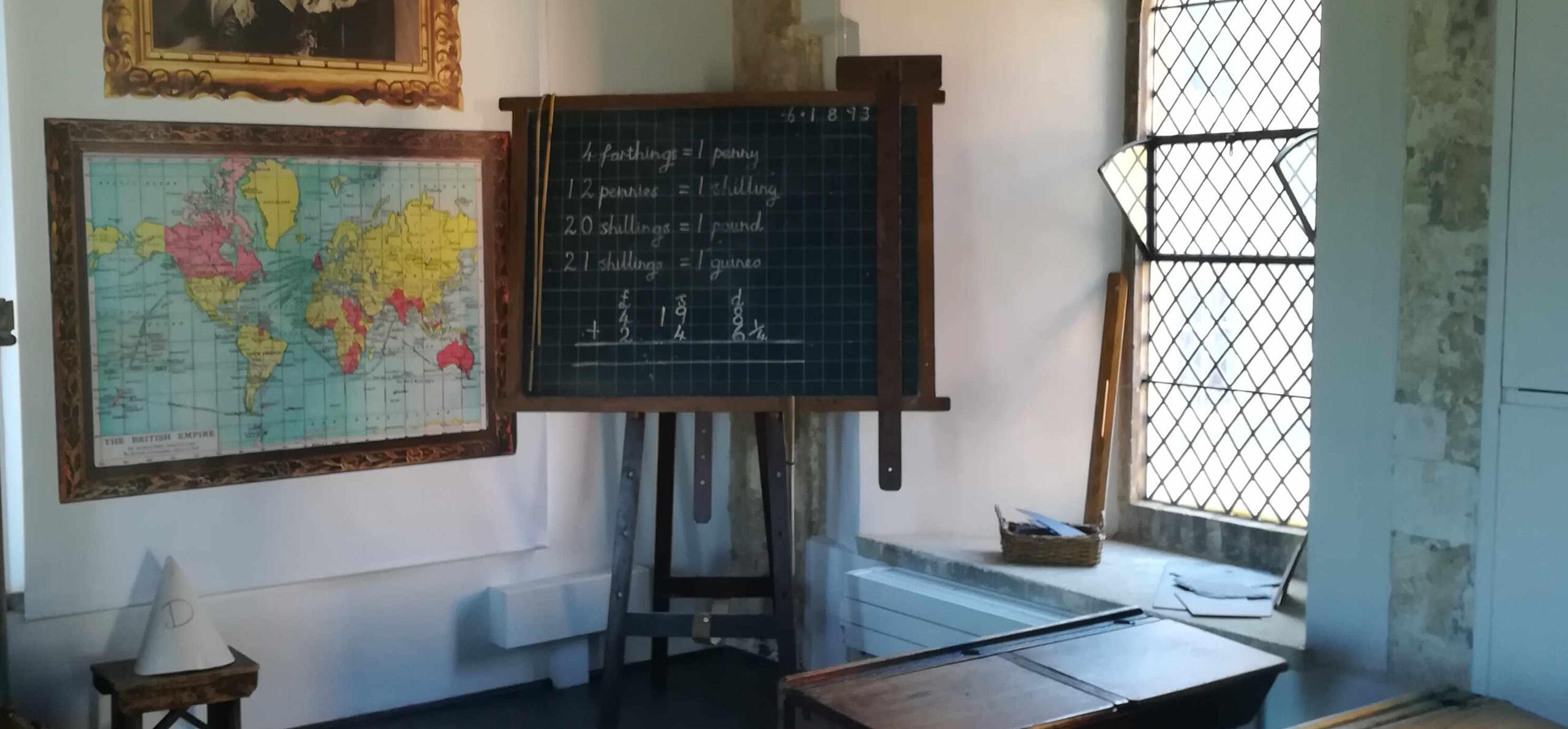 a view of an old black board and window in the Victorian