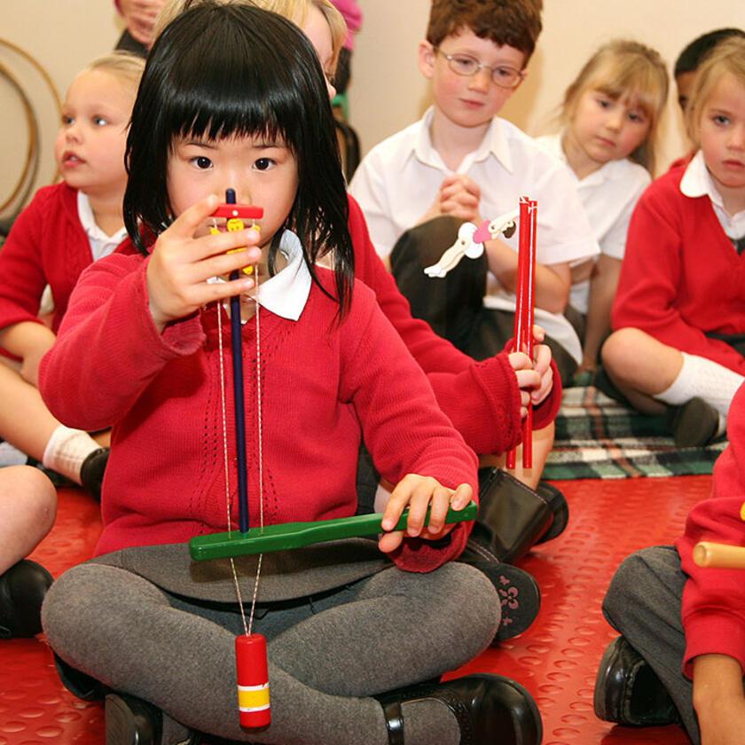 children playing with Victorian toys