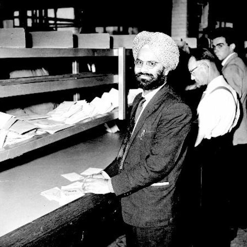 Sikh postal worker sorting mail at Reading sorting office in 1964 (object no. 1980.36.D595.2a)